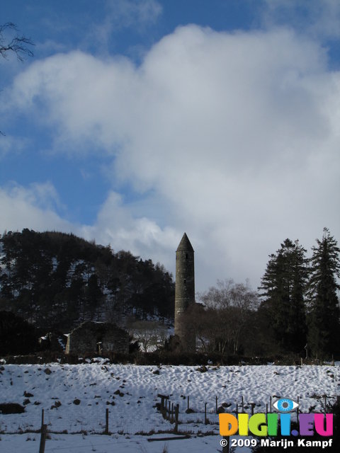 SX02460 Glendalough Round Tower in snow